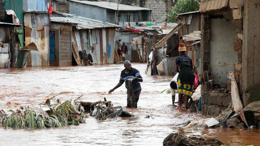 Residents recover their belongings after the Nairobi river burst its banks in Mathare Valley settlement in Nairobi