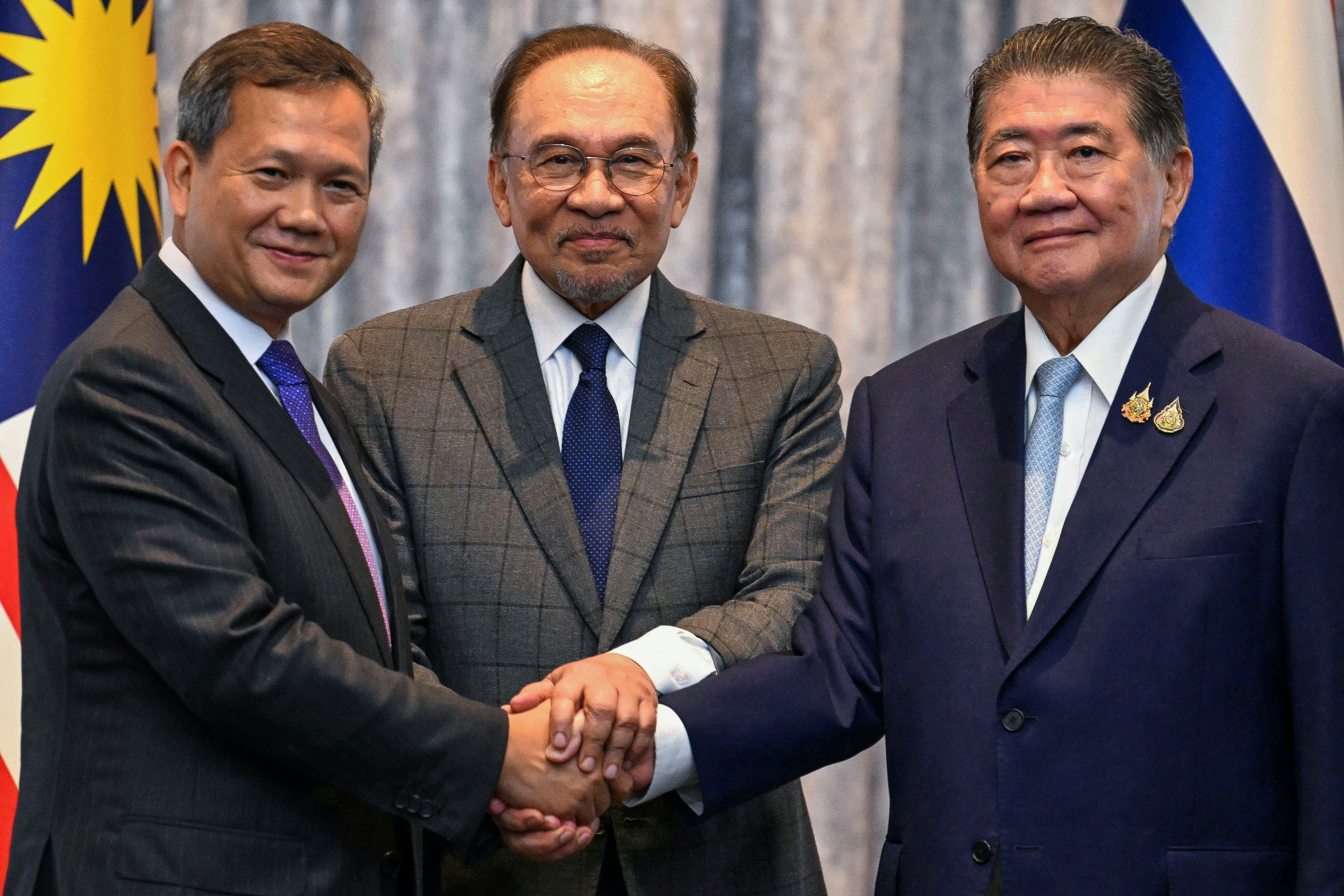 Malaysia's Prime Minister Ibrahim, Cambodia's Prime Minister Manet and Thailand's acting Prime Minister Wechayachai take part in mediation talks, in Putrajaya