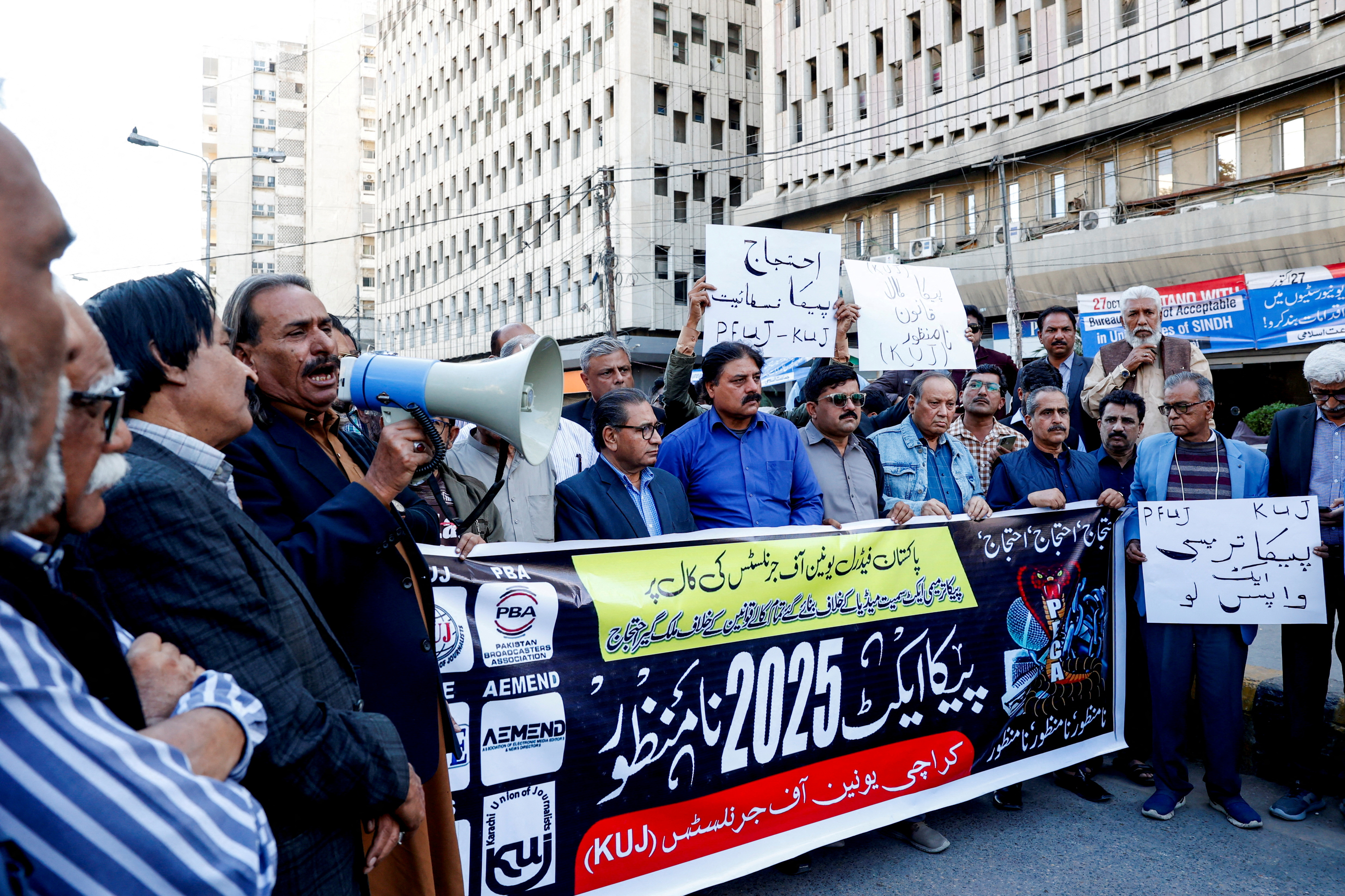 FILE PHOTO: Journalists protest against what they call curbs on press freedom, in Karachi