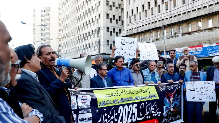 FILE PHOTO: Journalists protest against what they call curbs on press freedom, in Karachi
