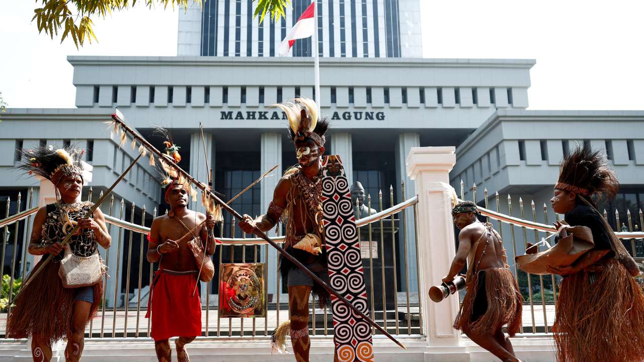 FILE PHOTO: Protest against deforestation in indigenous Papuans' land, outside the country's Supreme Court in Jakarta