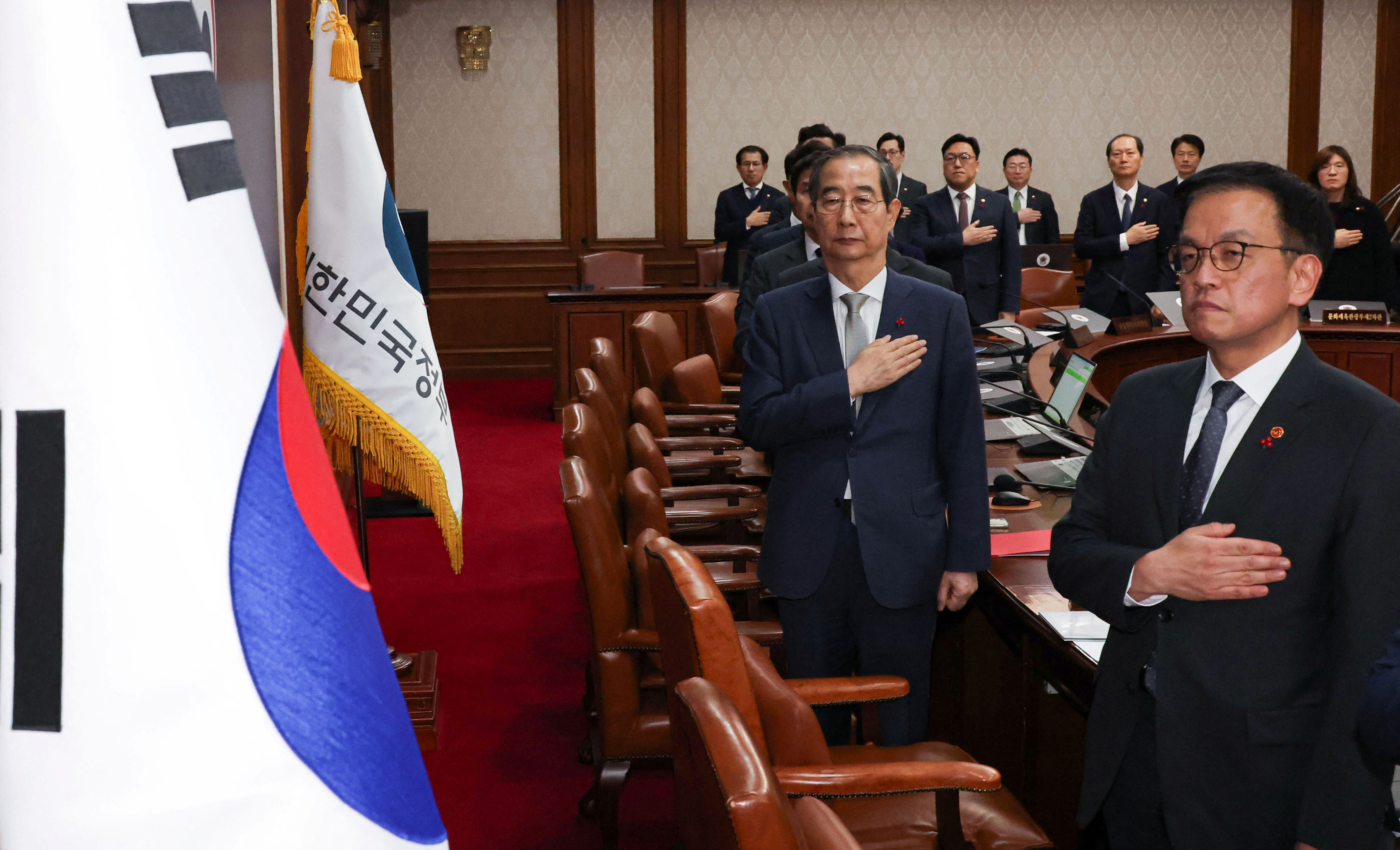 Acting South Korean President and Prime Minister Han Duck-soo presides over a cabinet meeting at the government complex in Seoul