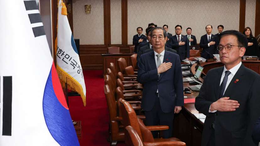 Acting South Korean President and Prime Minister Han Duck-soo presides over a cabinet meeting at the government complex in Seoul