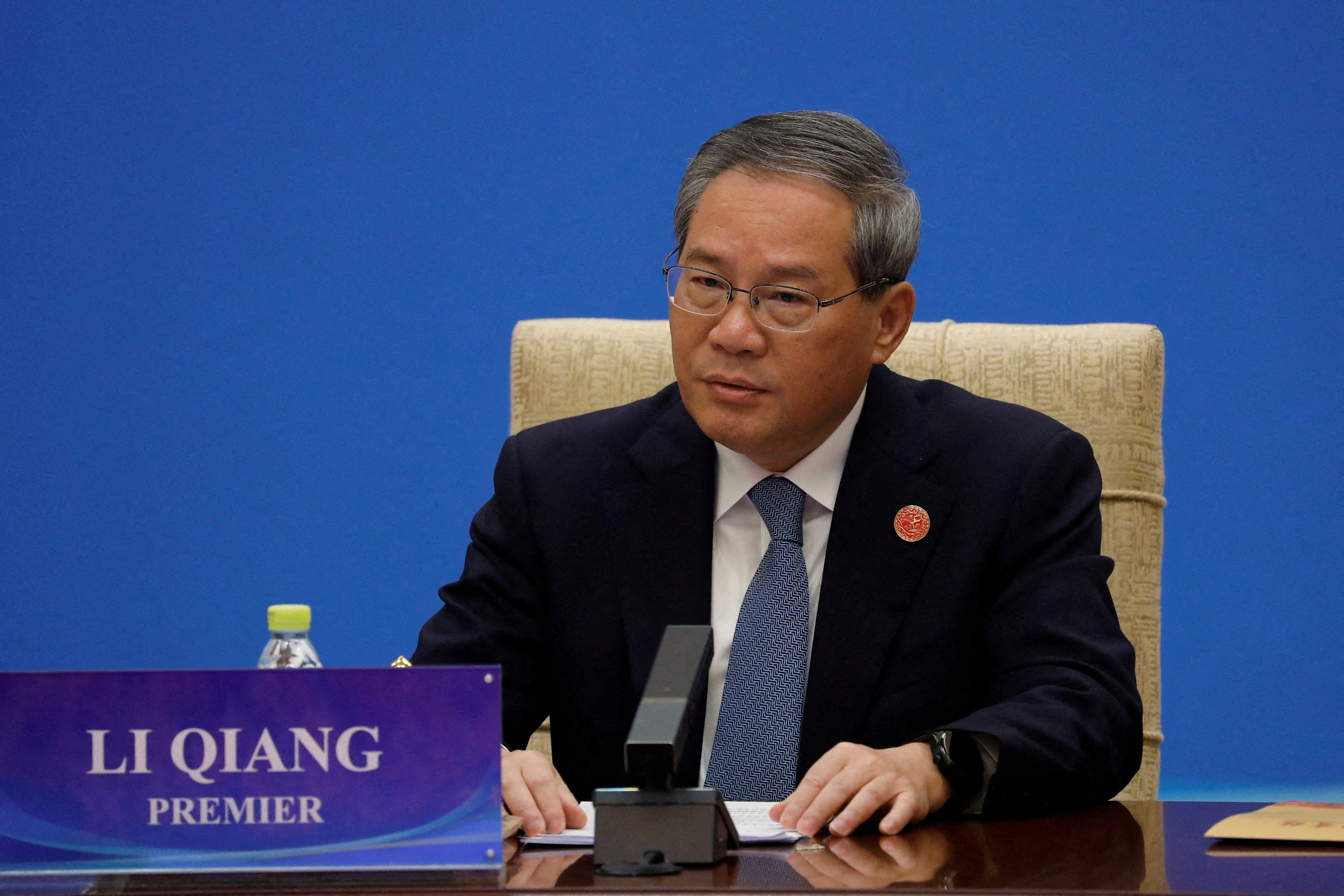 FILE PHOTO: Chinese Premier Li Qiang attends an economic conference in Beijing
