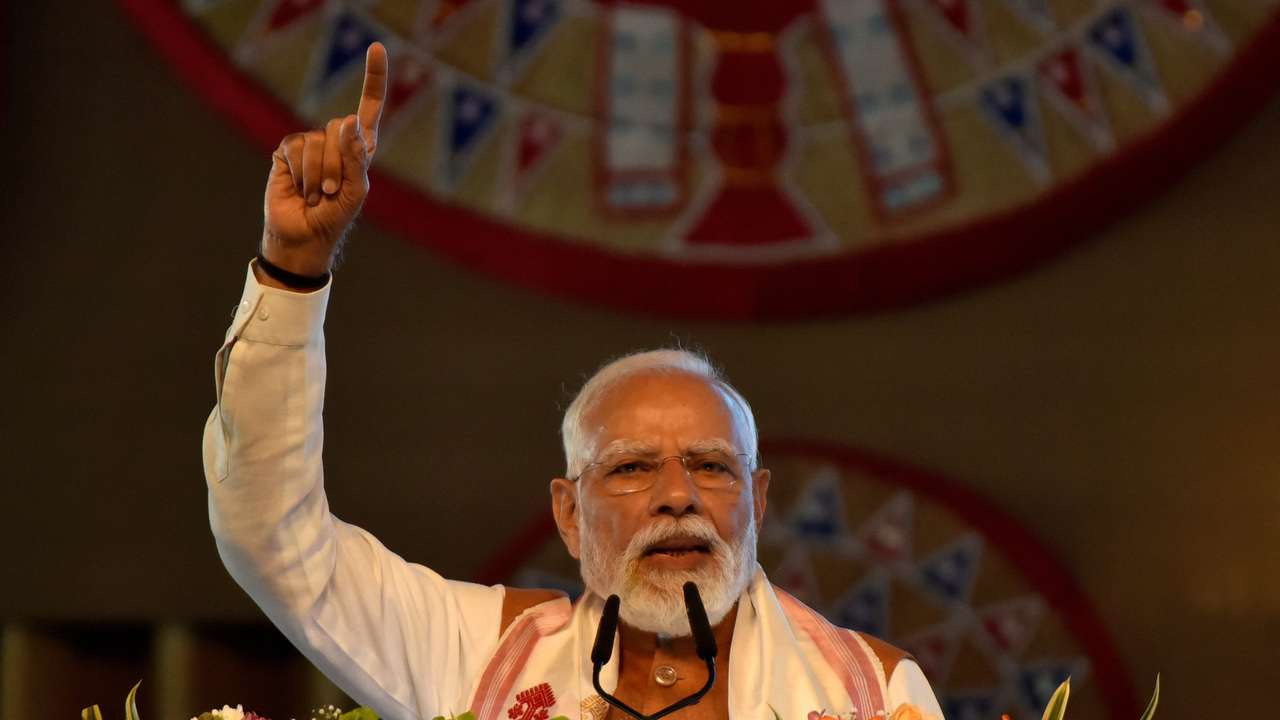 India's PM Modi addresses his supporters after he inaugurated a new terminal building of Lokpriya Gopinath Bordoloi International Airport in Guwahati