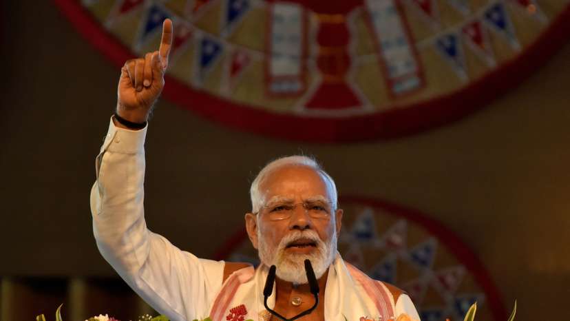 India's PM Modi addresses his supporters after he inaugurated a new terminal building of Lokpriya Gopinath Bordoloi International Airport in Guwahati