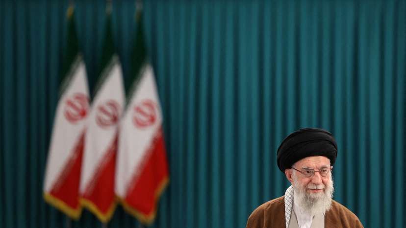 FILE PHOTO: Iran's Supreme Leader Ayatollah Ali Khamenei votes during runoff parliamentary election, in Tehran
