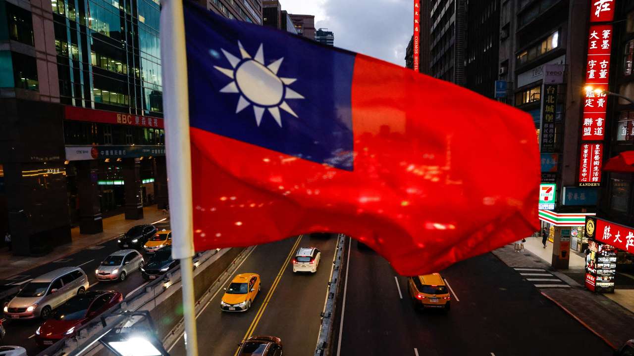 A Taiwan flag can be seen on an overpass ahead of National Day celebrations in Taipei