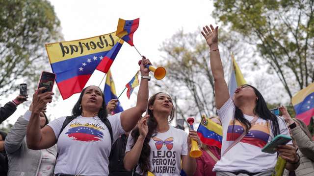 Venezuelans cast their vote to elect president, in Bogota