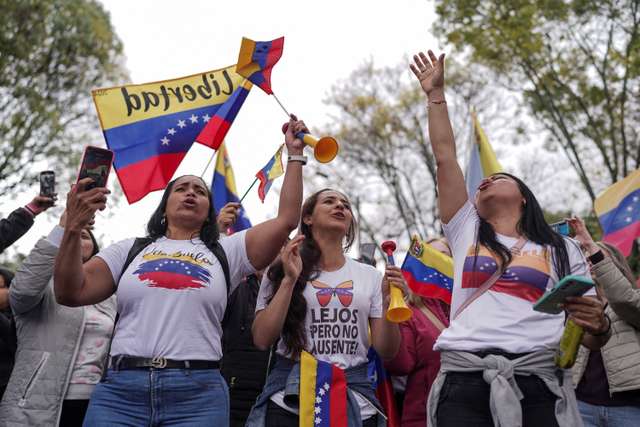 Venezuelans cast their vote to elect president, in Bogota