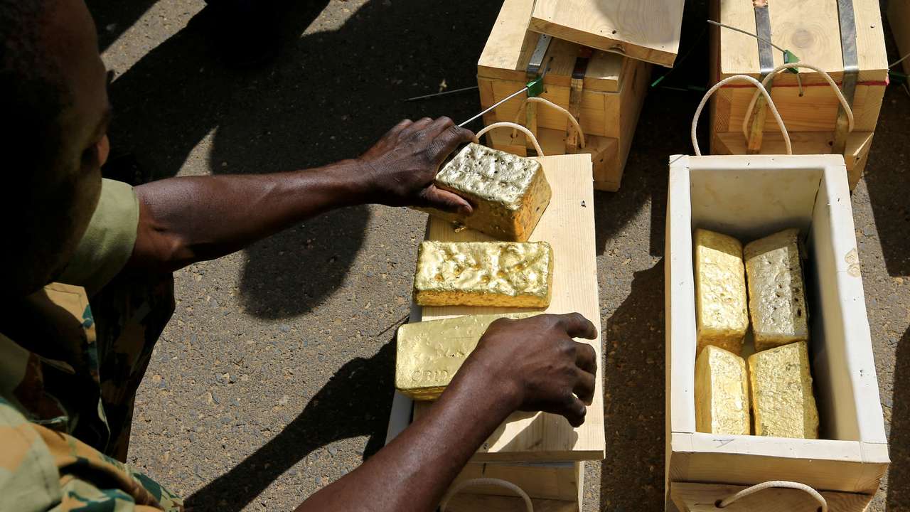 FILE PHOTO: Sudanese Rapid Support Forces (RSF) display gold bars seized from a plane that landed at Khartoum Airport in an investigation into possible smuggling, in Khartoum