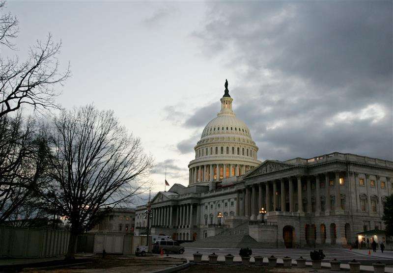 The dome of the United States Capitol building is illuminated at twilight on Capitol Hill in Washington January 31, 2006.