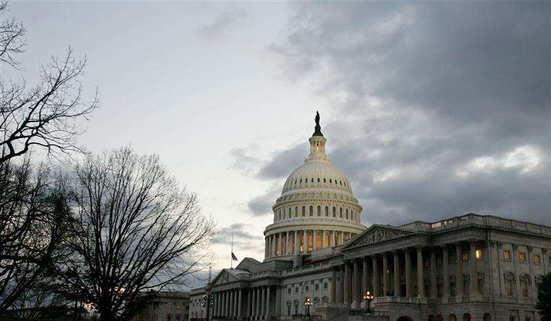 The dome of the United States Capitol building is illuminated at twilight on Capitol Hill in Washington January 31, 2006.