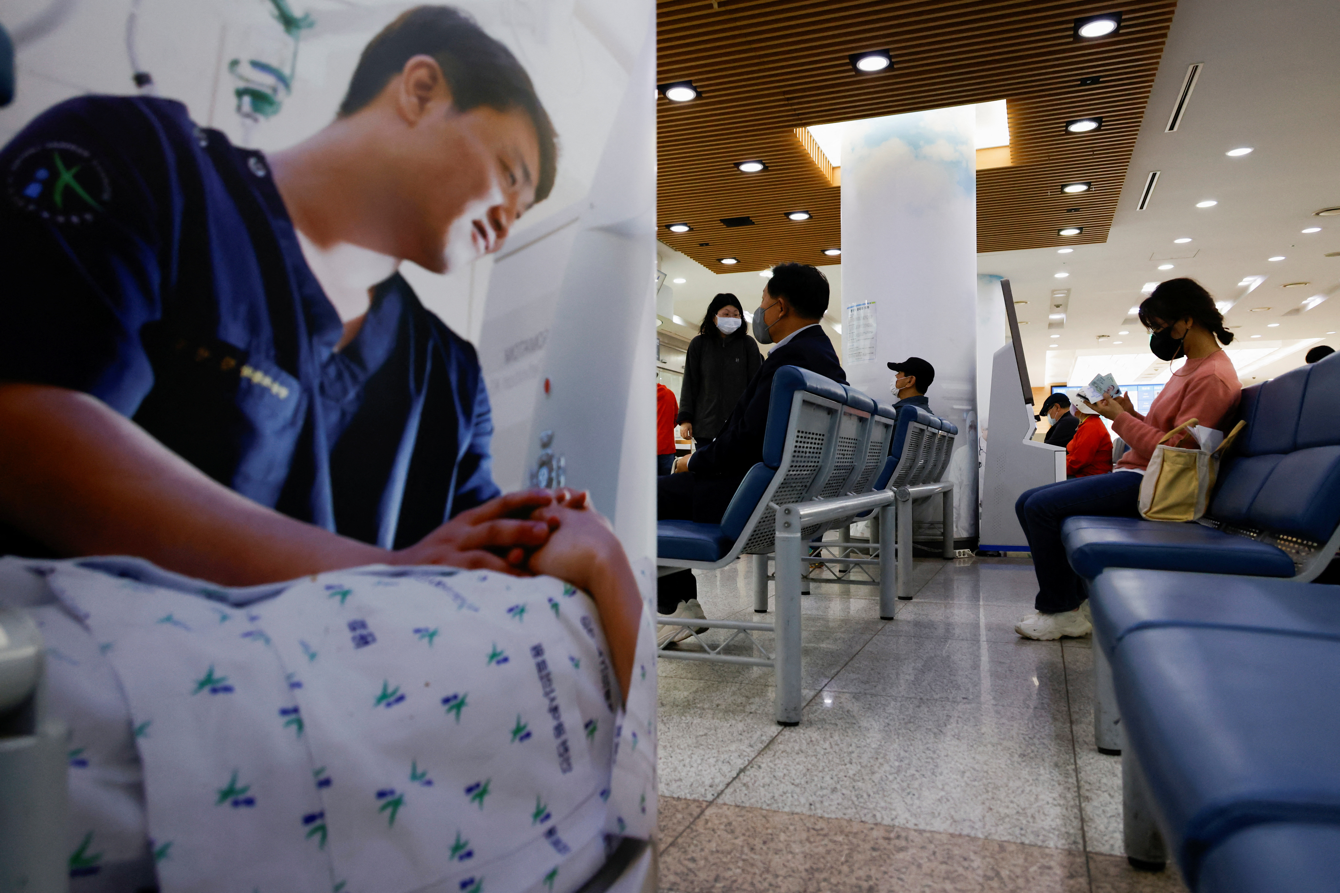 People sit as they wait at the Incheon Medical Center in Incheon