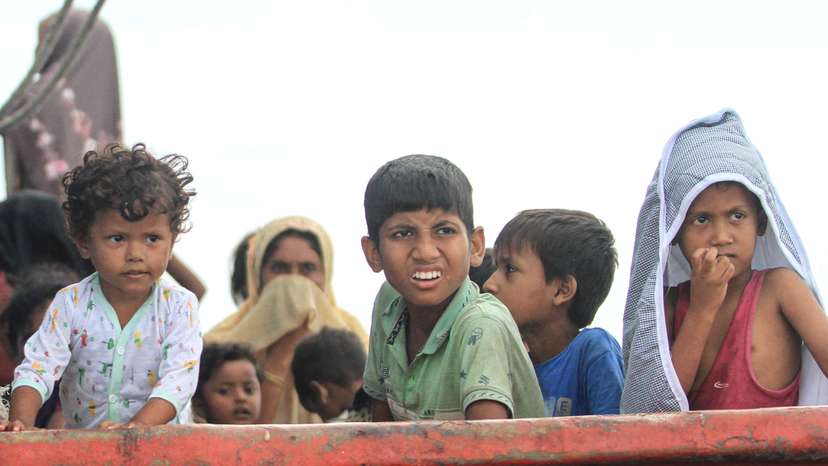 Rohingya refugee children are seen on a boat, after Rohingya refugees, mostly women and children, got stranded due to a boat engine failure in the waters of South Aceh