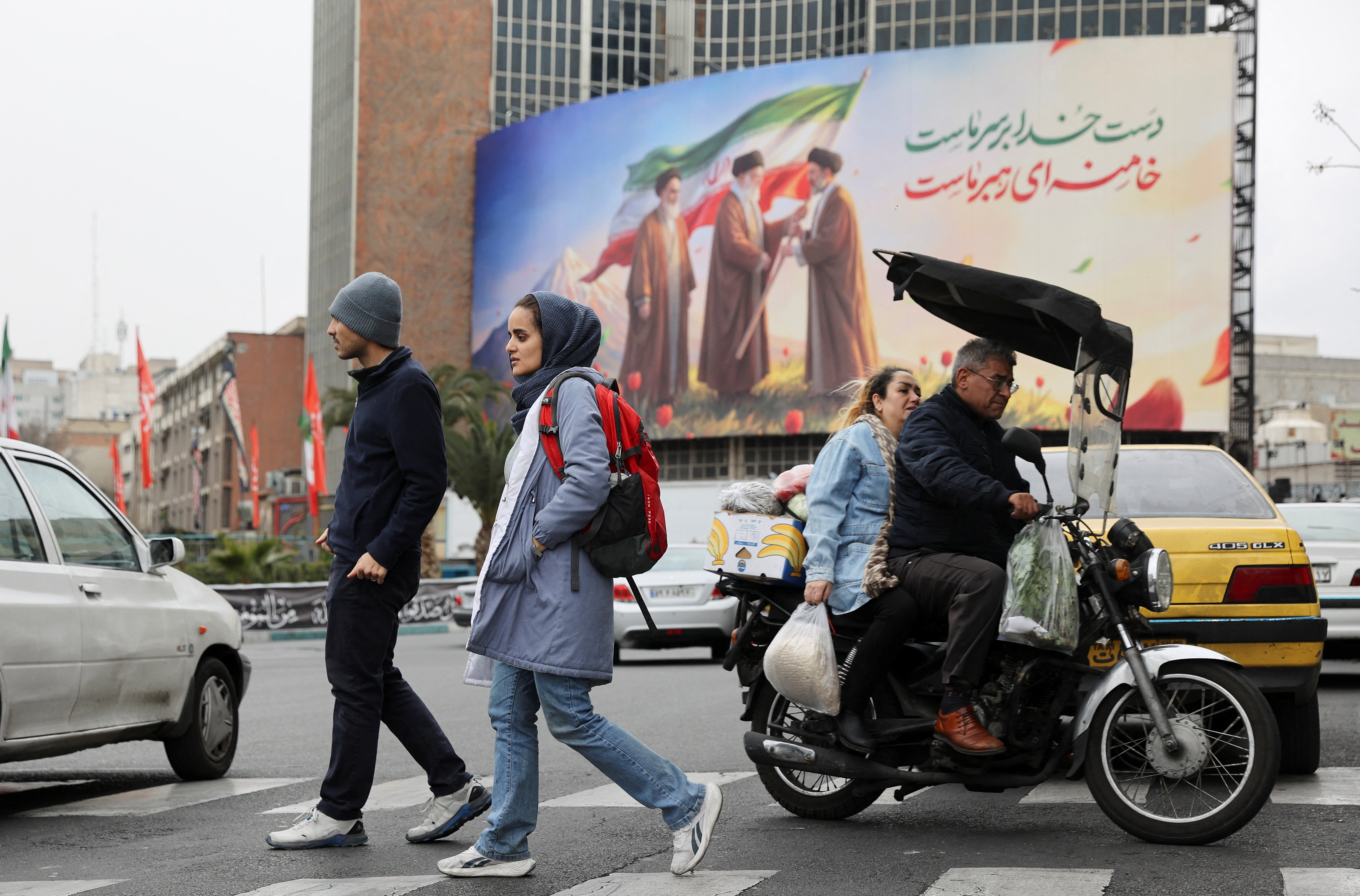 A banner of Iran's new supreme leader Mojtaba Khamenei with late supreme leader Ayatollah Ali Khamenei, in Tehran
