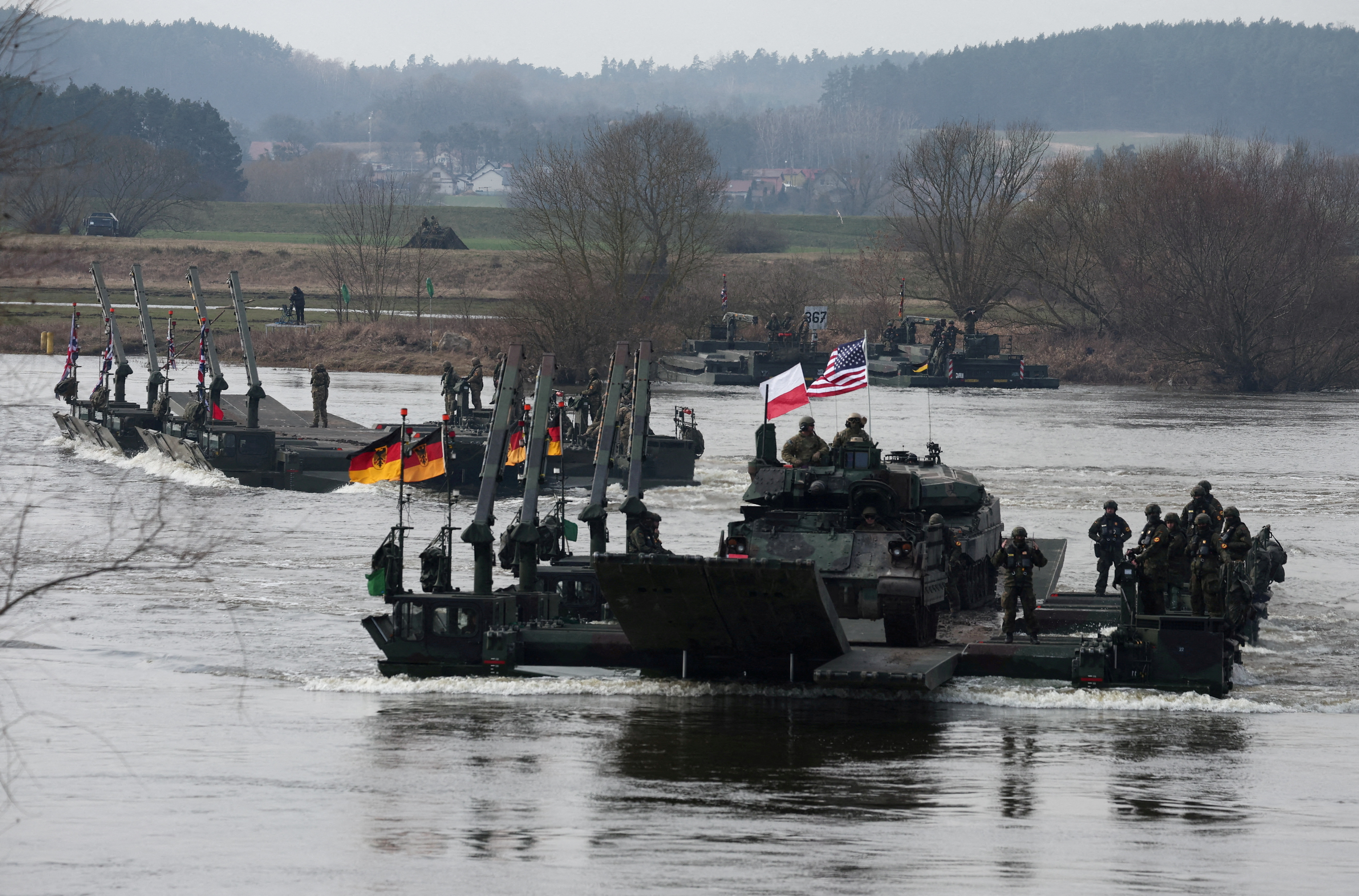 FILE PHOTO: Wet gap crossing at NATO Dragon-24, part of the Steadfast Defender 2024 exercise, in Korzeniewo