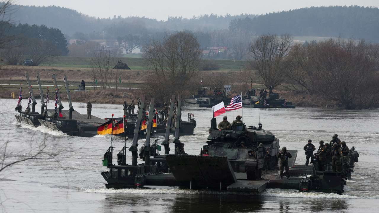 FILE PHOTO: Wet gap crossing at NATO Dragon-24, part of the Steadfast Defender 2024 exercise, in Korzeniewo