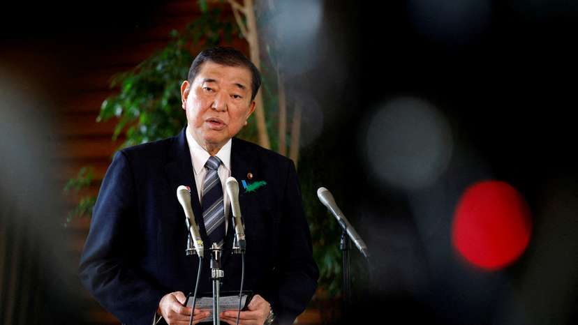 FILE PHOTO: Prime Minister Ishiba reacts after a Japanese negotiator held ministerial talks at the White House regarding US tariffs