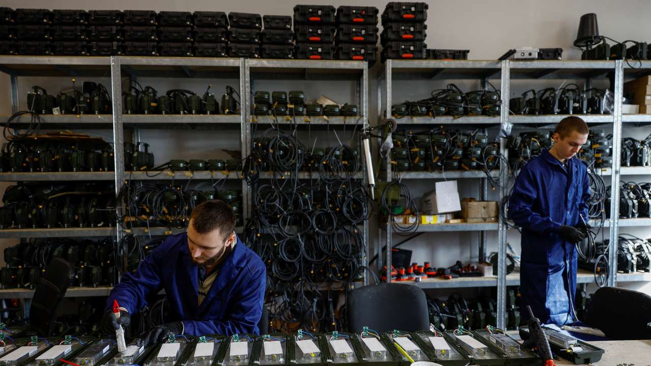 Employees work at a production facility of a Ukrainian producer of jammers and radio electronic warfare in an undisclosed location in Ukraine
