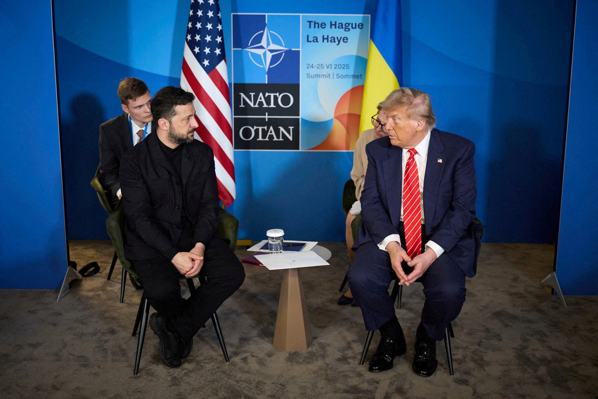 FILE PHOTO: U.S. President Trump and Ukraine's President Zelenskiy attend a meeting on the sidelines of NATO summit in The Hague