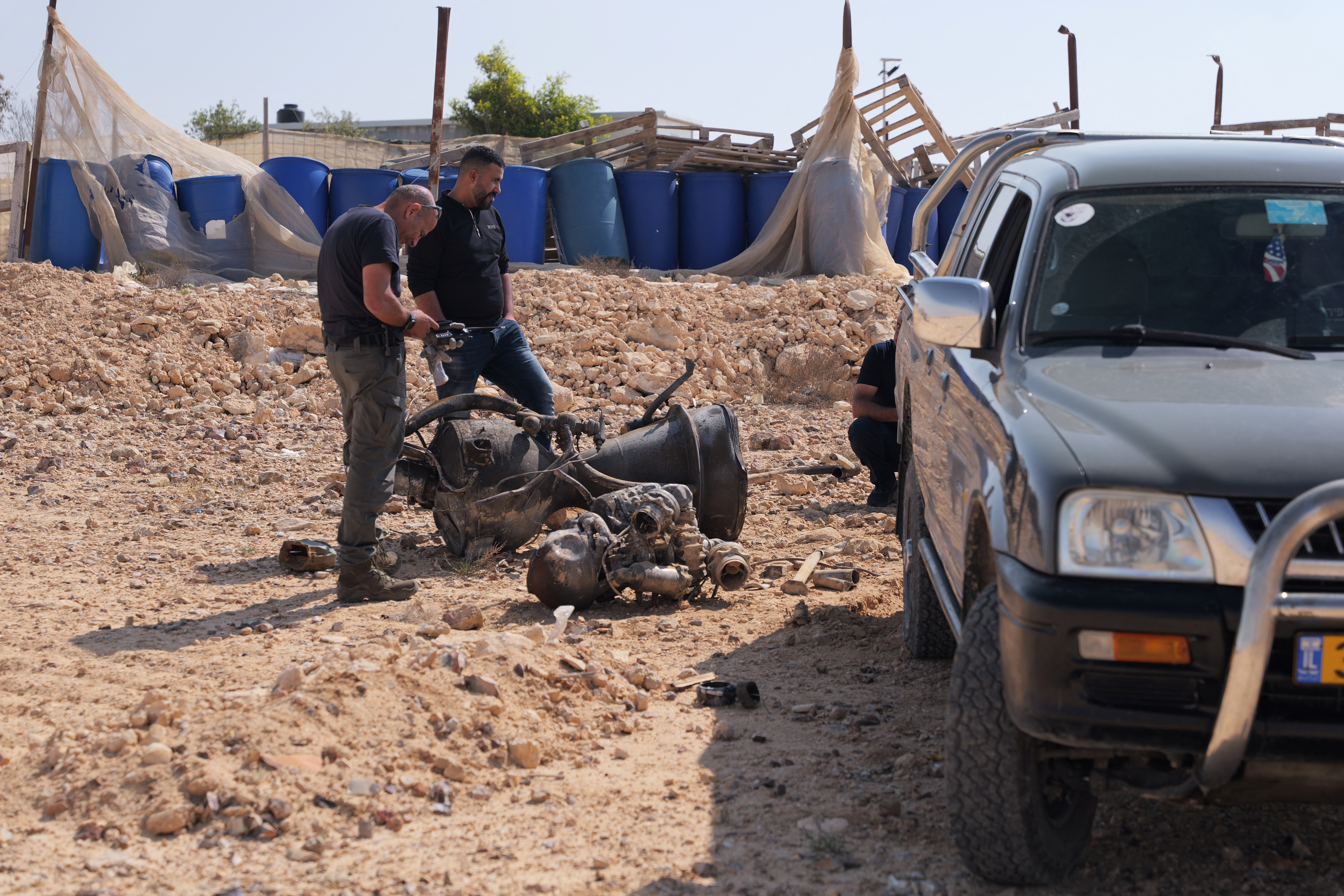 The remains of a rocket booster that, according to Israeli authorities critically injured a 7-year-old girl, after Iran launched drones and missiles towards Israel, near Arad