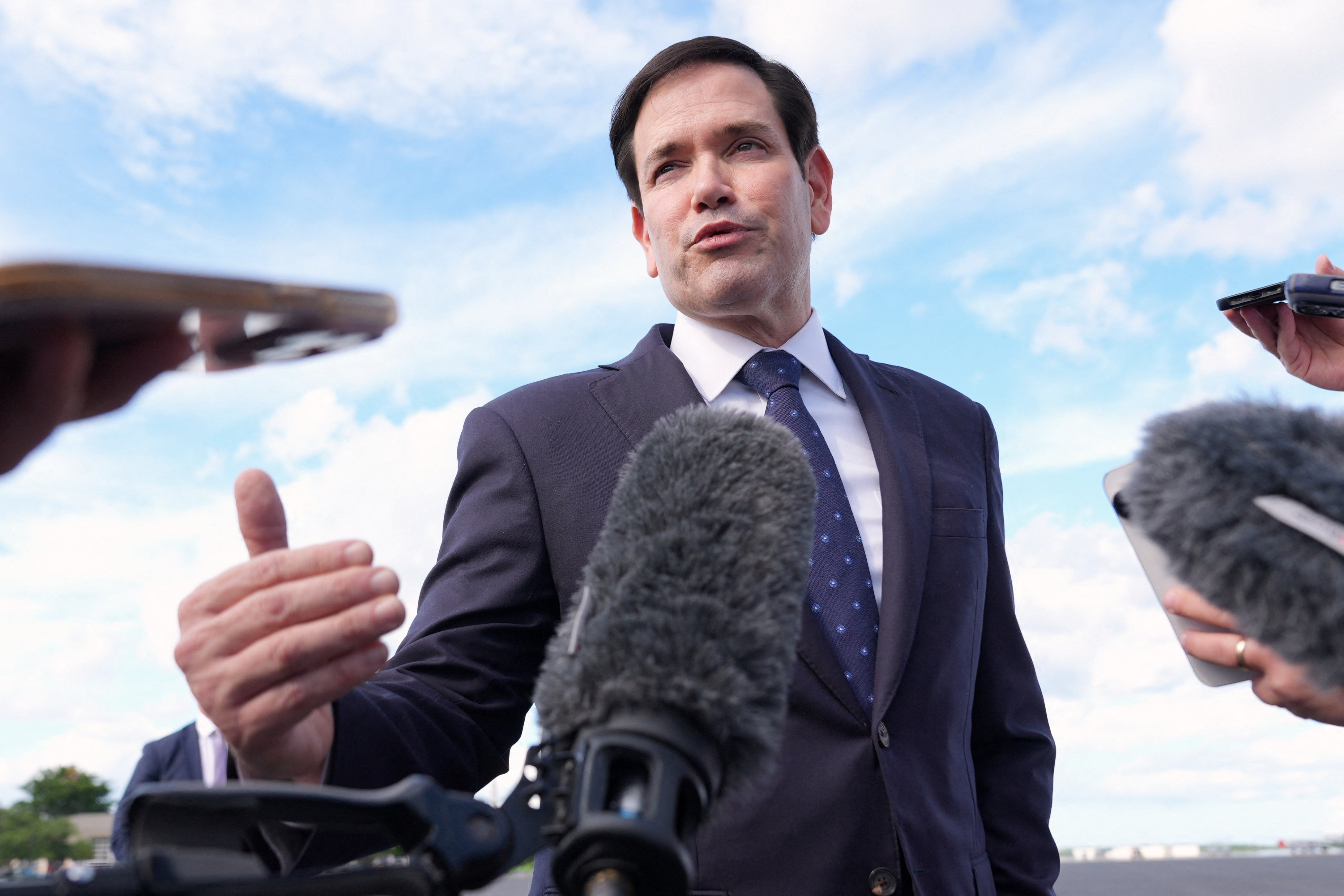 U.S. Secretary of State Marco Rubio speaks to reporters before boarding his plane at Homestead Air Reserve Base in Homestead