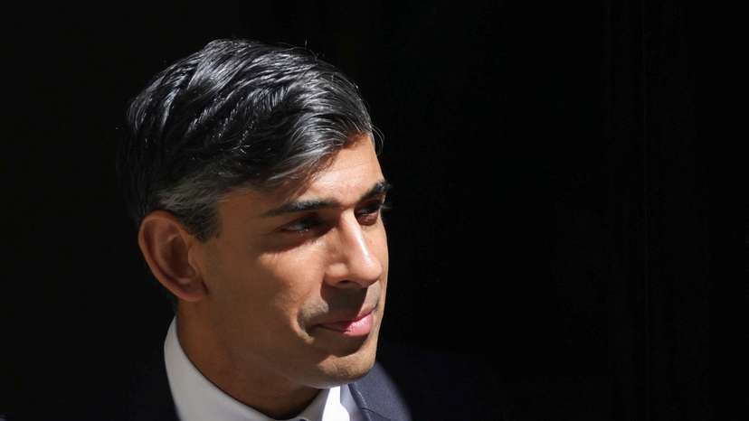 FILE PHOTO: British PM Sunak walks on Downing Street in London