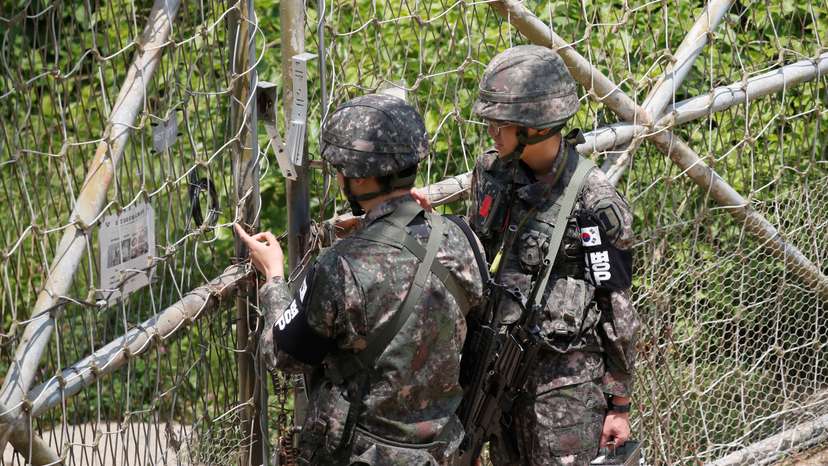 South Korean soldiers lock a gate at a guard post near the the demilitarized zone (DMZ) separating the two Koreas, in Paju, South Korea
