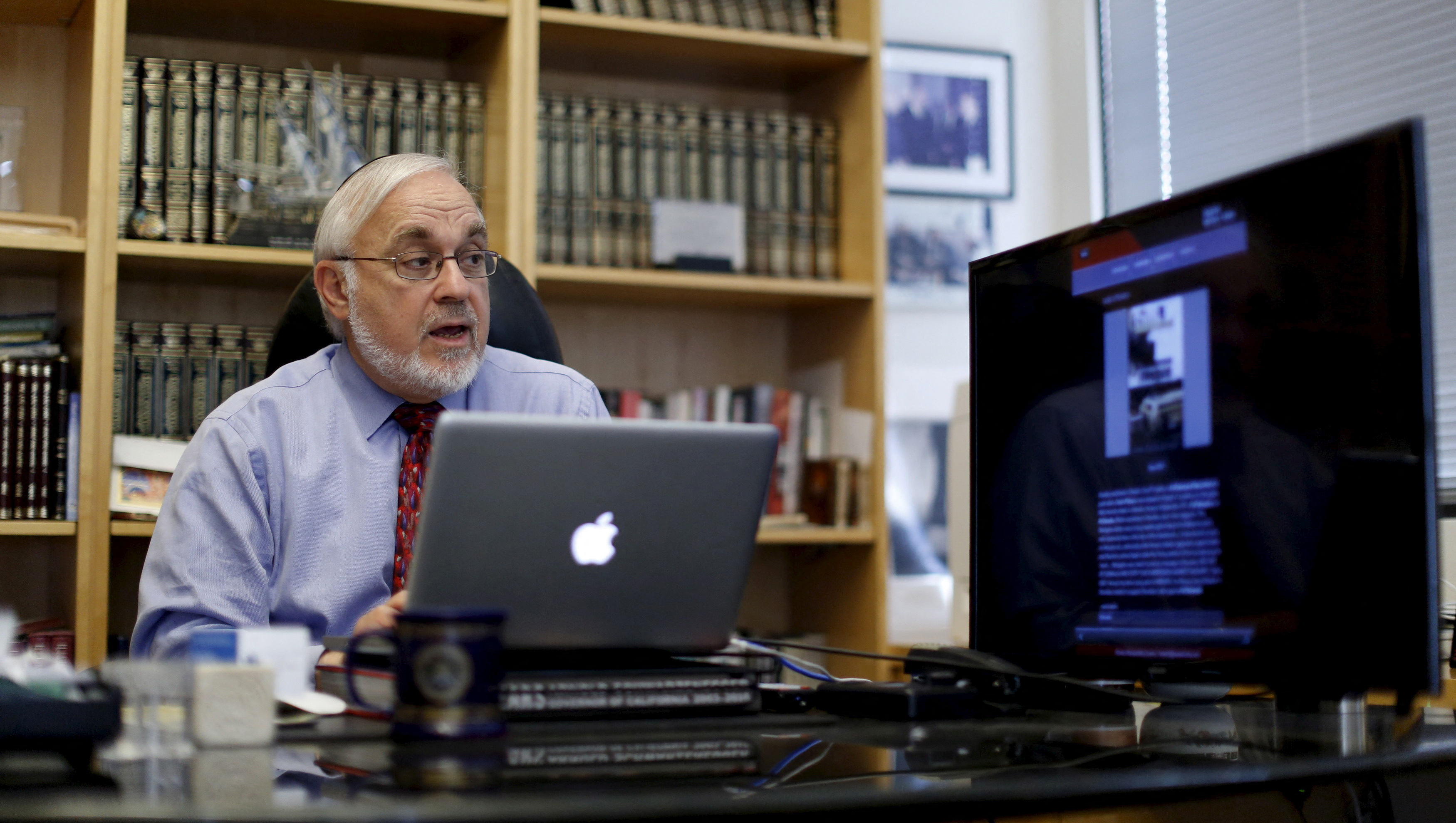 FILE PHOTO: Associate Dean Rabbi Abraham Cooper is pictured in his office at the Simon Wiesenthal Center in Los Angeles