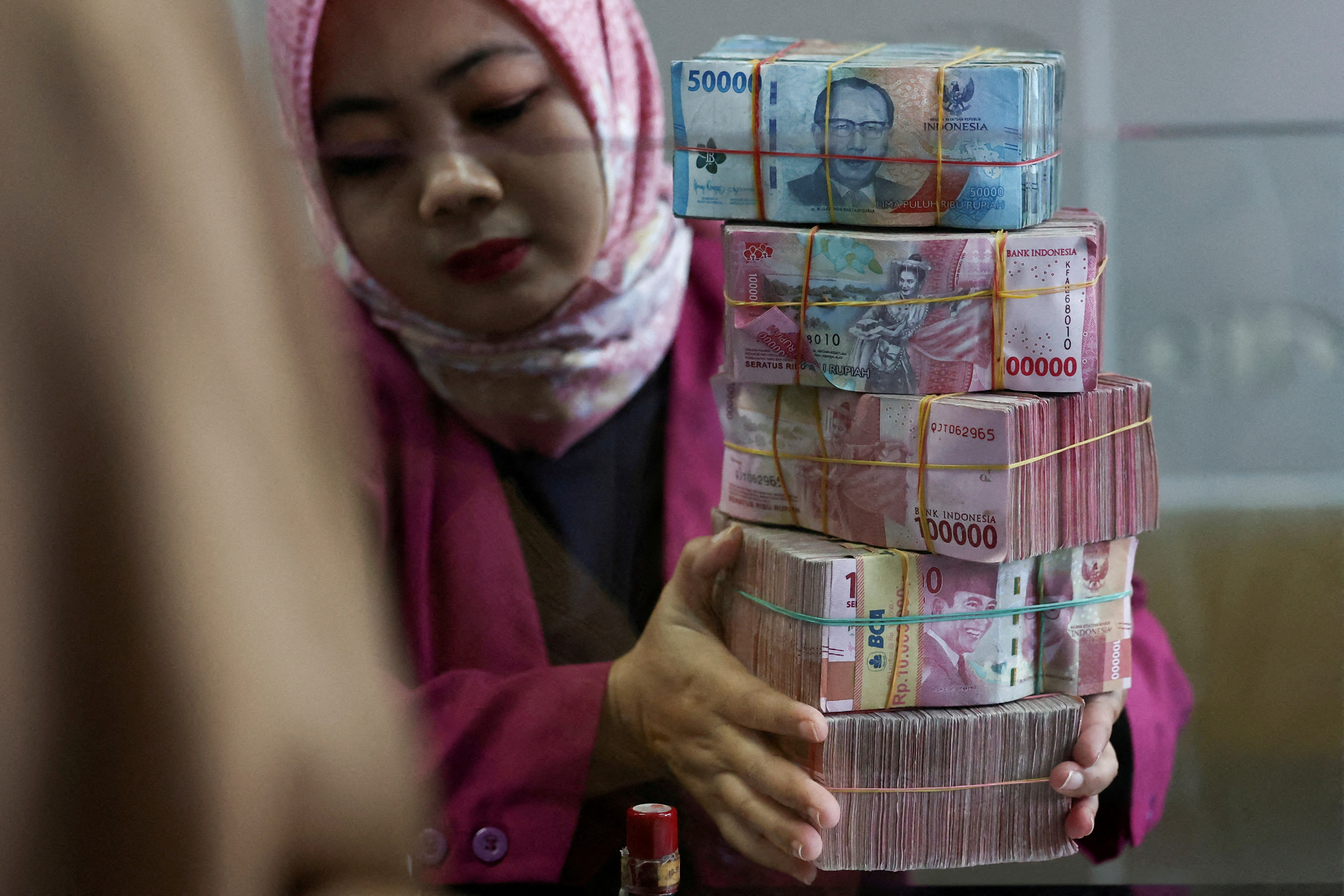 FILE PHOTO: Rupiah bank notes at a money changer in Jakarta