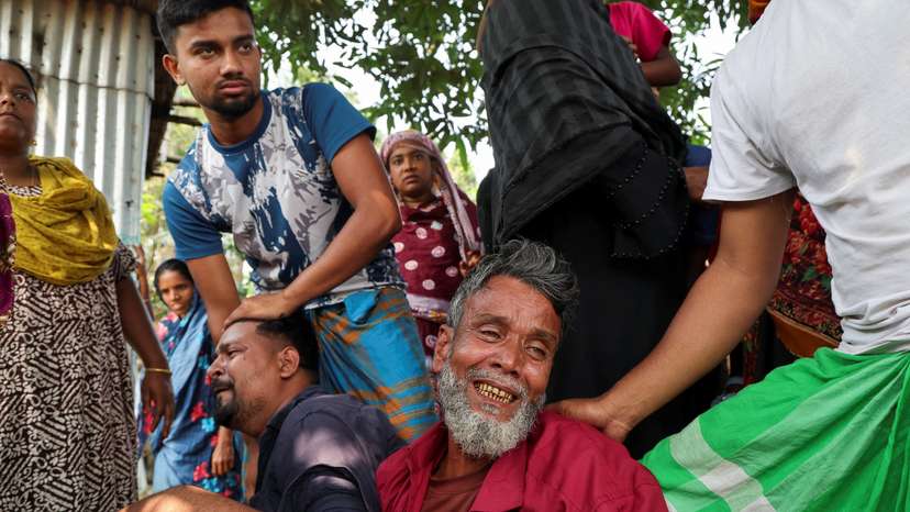 Relatives of a victim mourn after a bus plunged into the Padma River while attempting to board a ferry in Rajbari