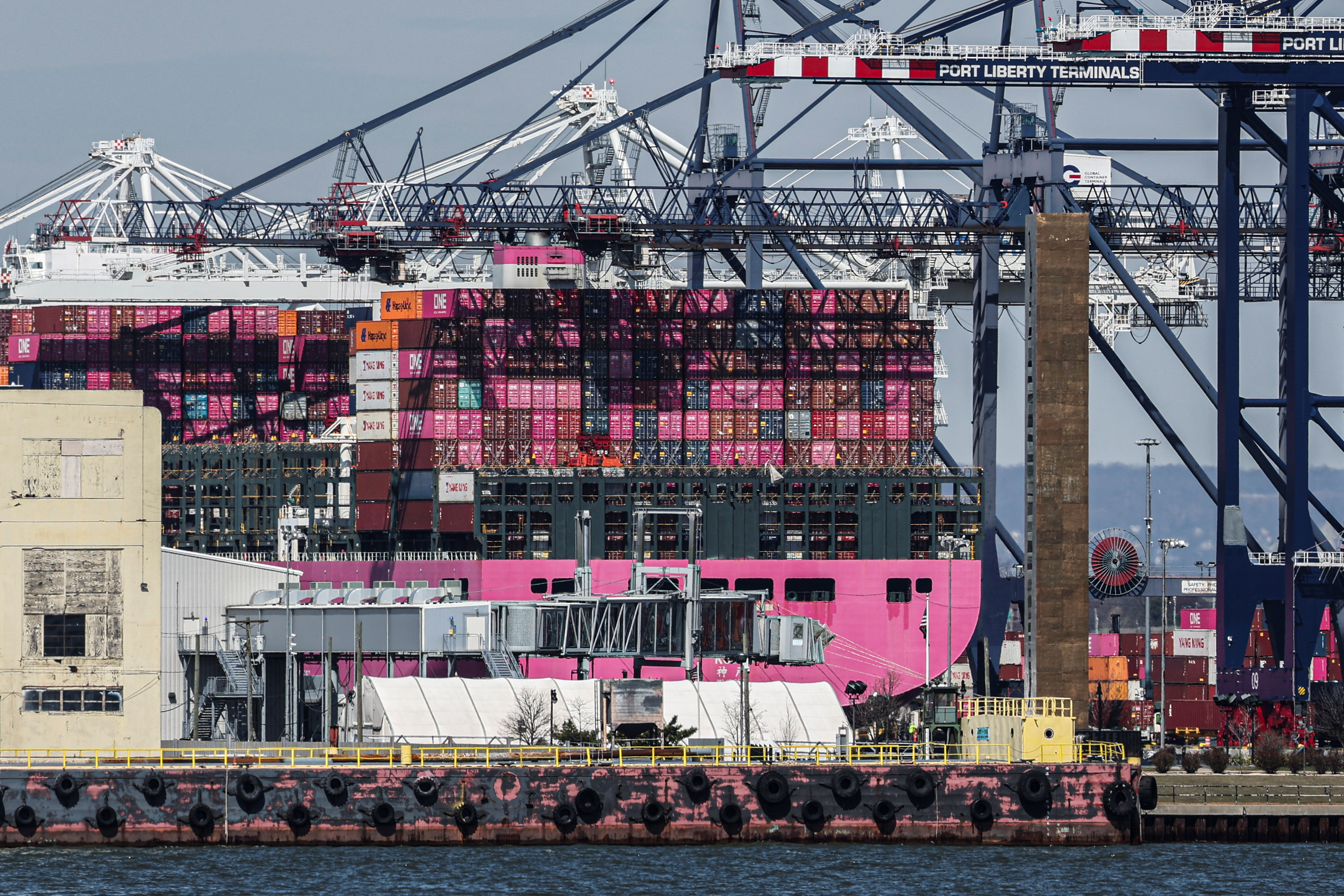 Containers are stacked on the deck of cargo ship One Minato at Port Liberty New York in Staten Island, New York