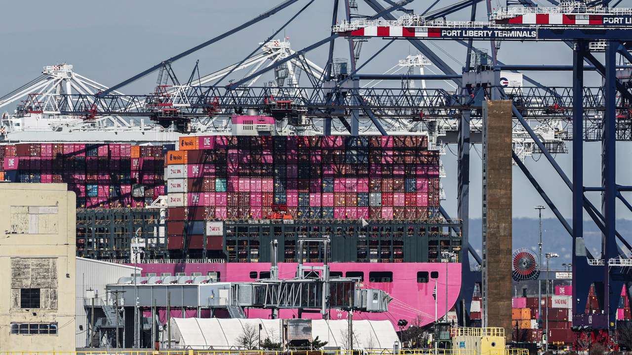 Containers are stacked on the deck of cargo ship One Minato at Port Liberty New York in Staten Island, New York
