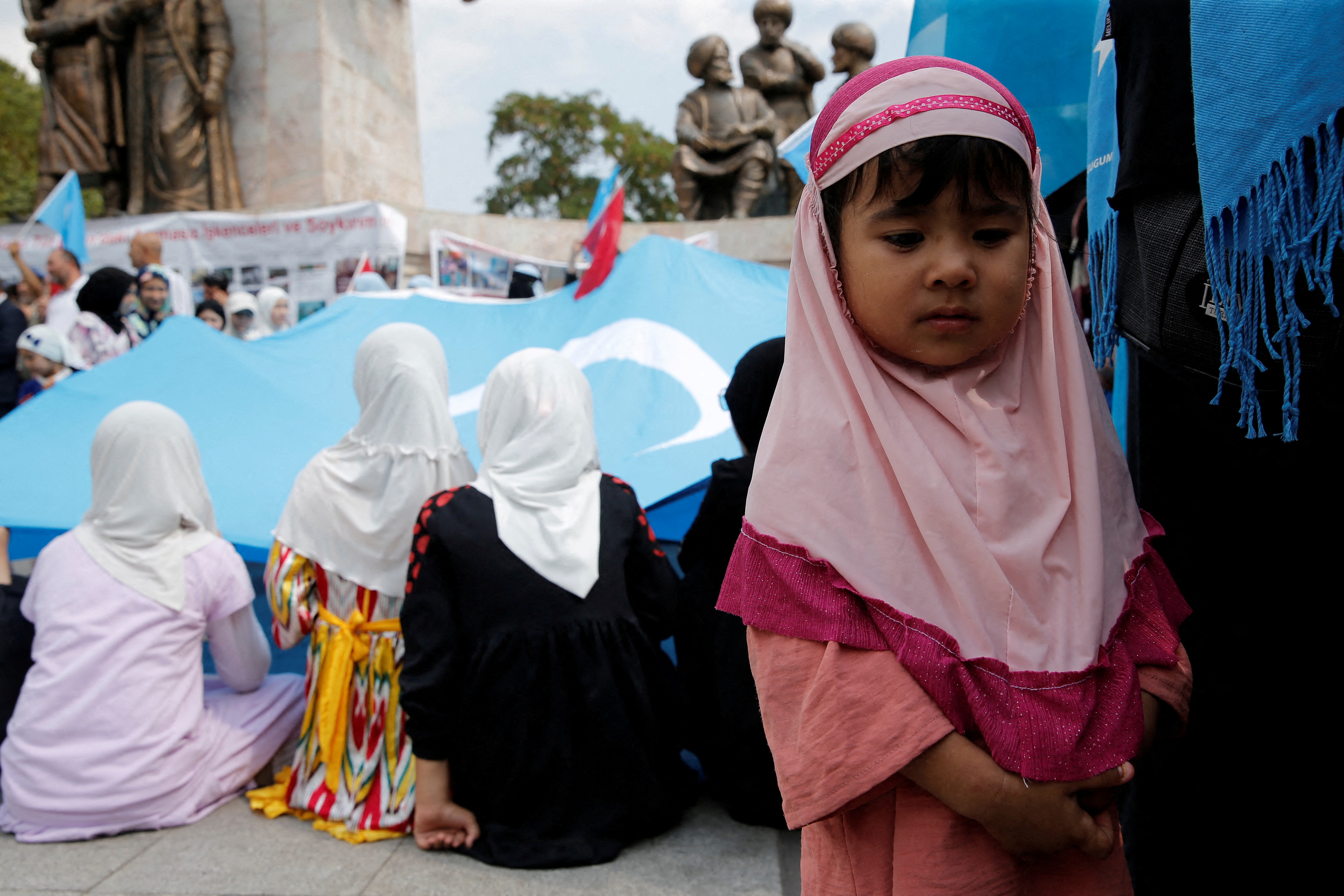 Ethnic Uyghur demonstrators take part in a protest against China, in Istanbul