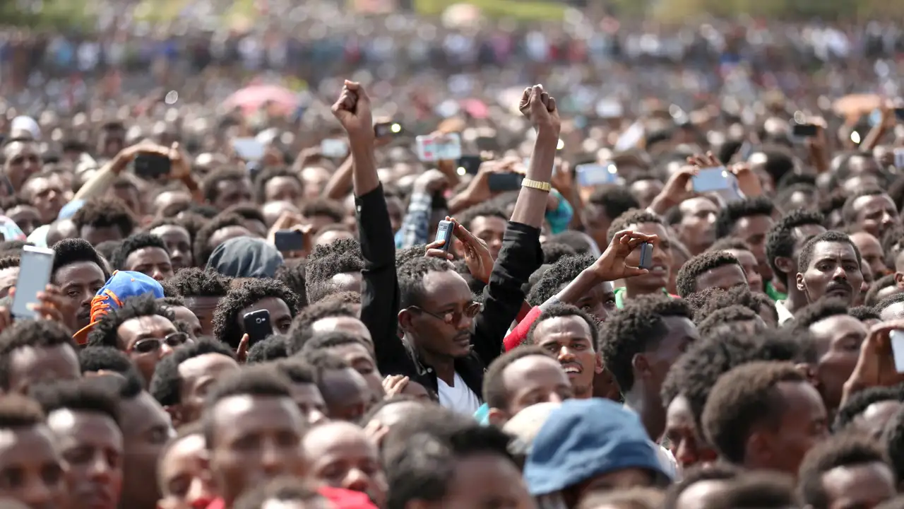FILE PHOTO: Residents attend a rally by Ethiopia's newly elected prime minister Abiy Ahmed during his visit Ambo in the Oromiya region