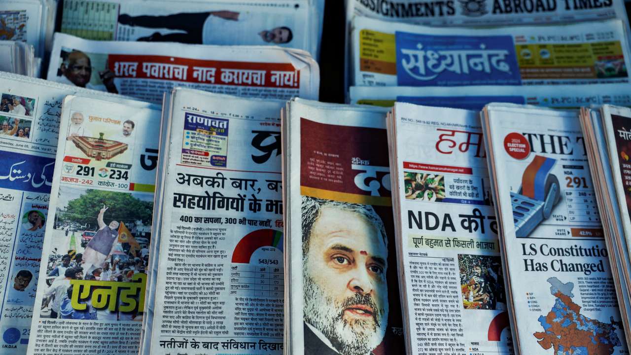 Newspapers are displayed at a stall following the results of India's general election, in Mumbai