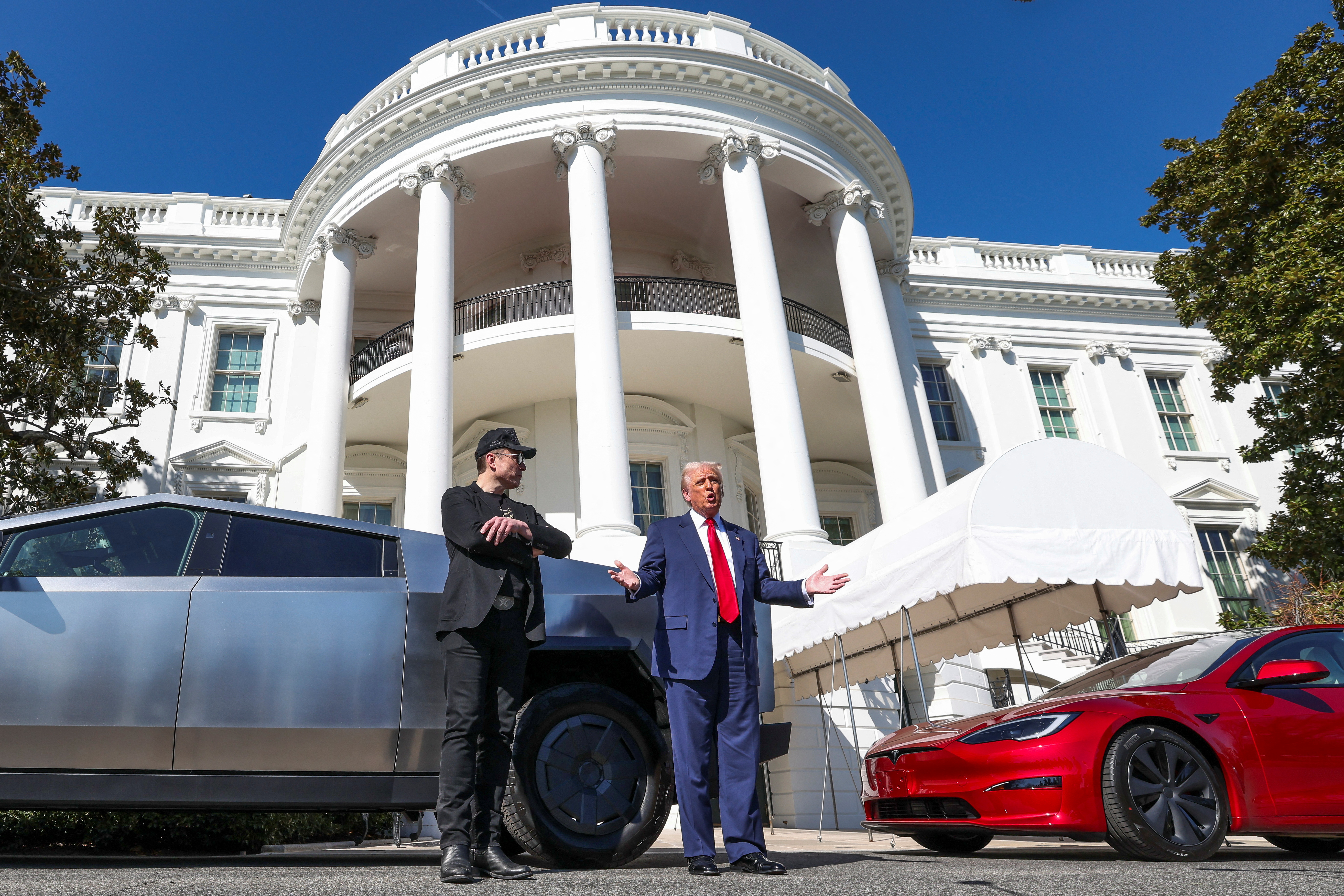 U.S. President Donald Trump views a Tesla car at the White House in Washington