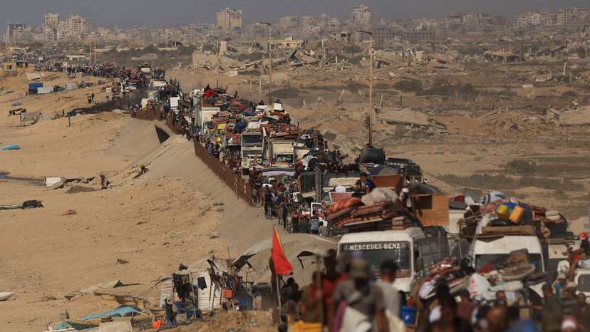 Displaced Palestinians flee southward in the central Gaza Strip after Israeli forces ordered residents of Gaza City to evacuate