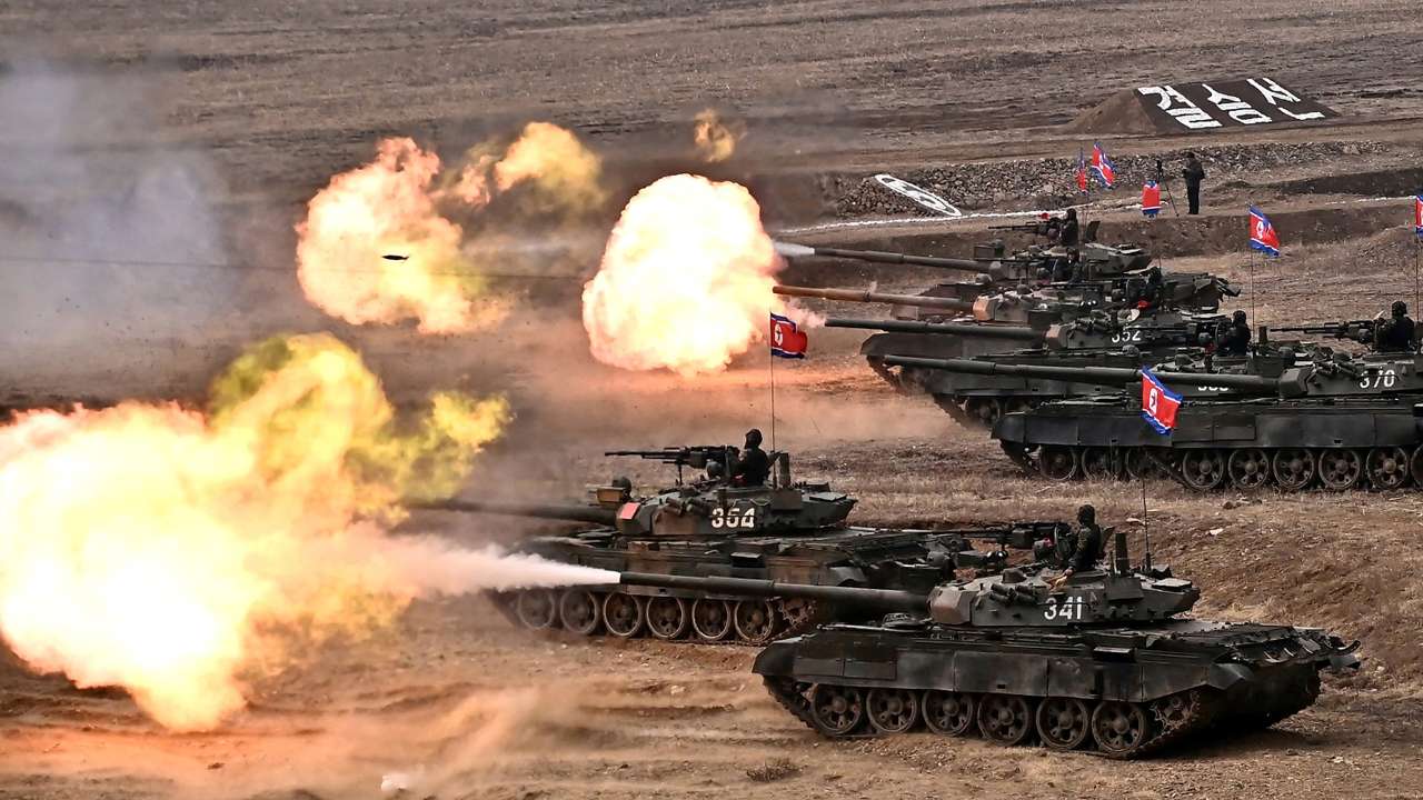 North Korean leader Kim Jong Un guides a military demonstration involving tank units