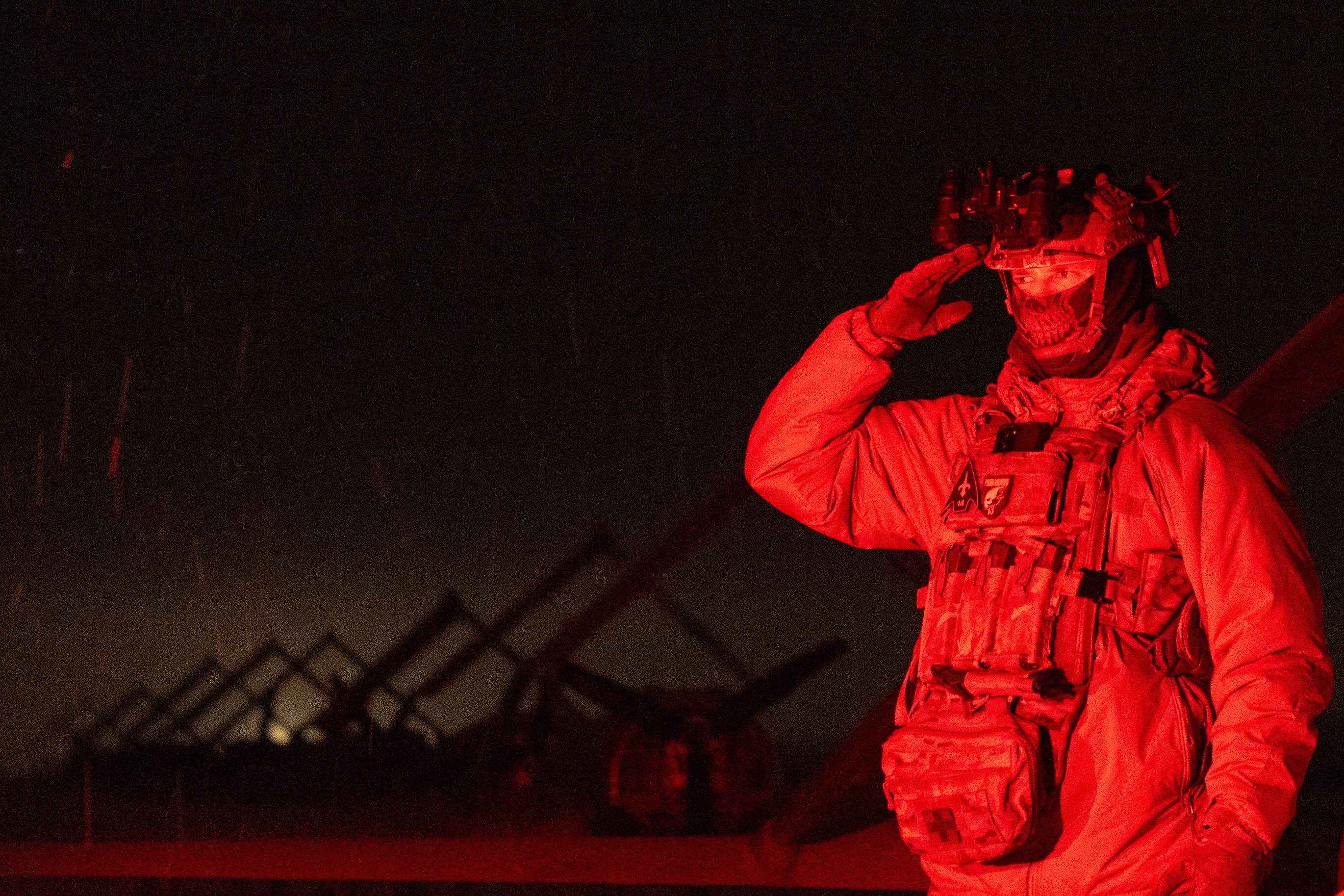 Ukrainian serviceman with the call sign 'Kasper' salutes next to deep strike unmanned aerial vehicles before launching them towards Russian territory in Ukraine