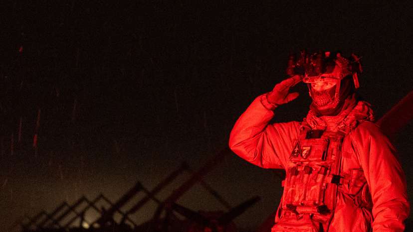 Ukrainian serviceman with the call sign 'Kasper' salutes next to deep strike unmanned aerial vehicles before launching them towards Russian territory in Ukraine