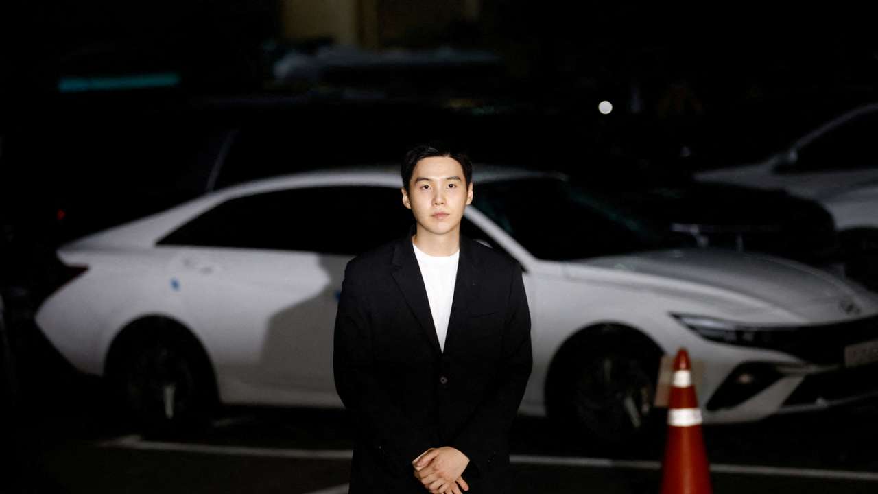 FILE PHOTO: Suga of the K-pop boy band BTS arrives at a police station for questioning regarding his drunk driving charge, in Seoul