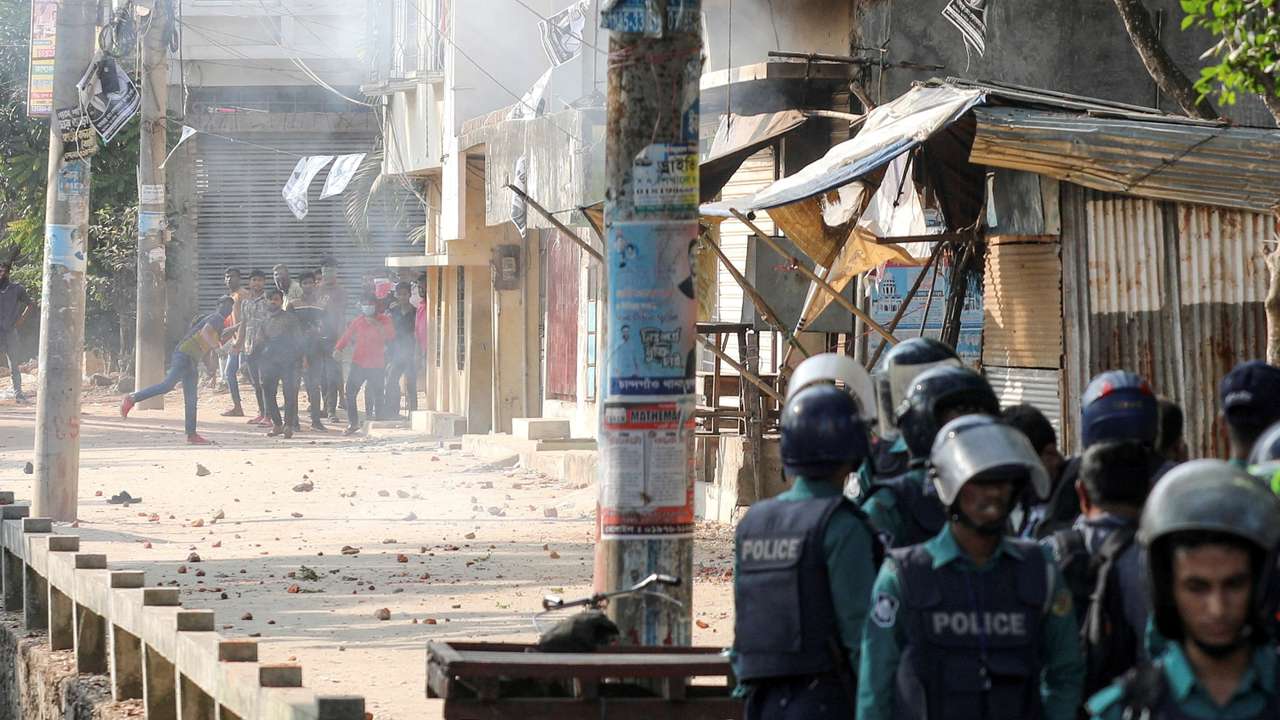 People confront with police during the 12th general election in Chattogram