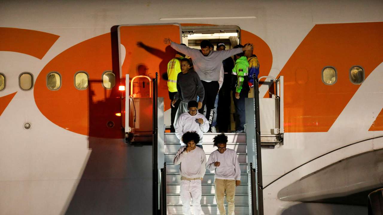 Venezuelan migrants arrive on a flight after being deported from the United States, in Caracas