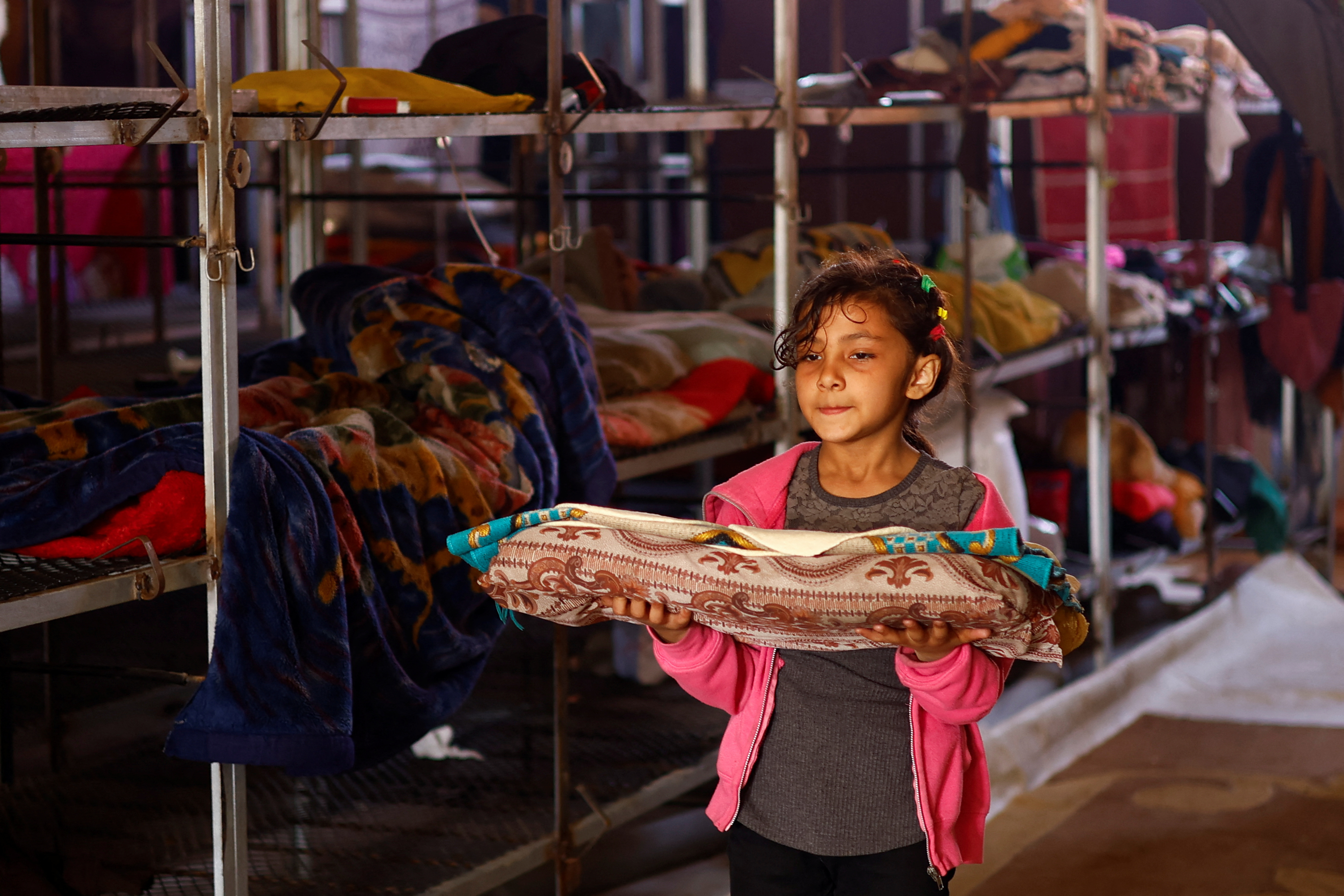 Displaced Gaza family takes refuge in a poultry farm, turns cages into beds