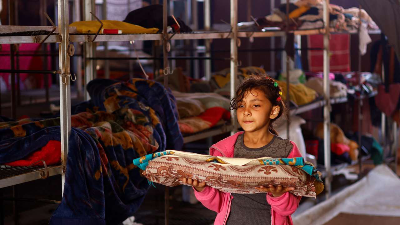 Displaced Gaza family takes refuge in a poultry farm, turns cages into beds