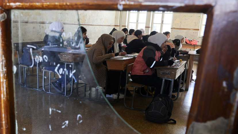 Students in a classroom after authorities announced the reopening of schools, in Damascus