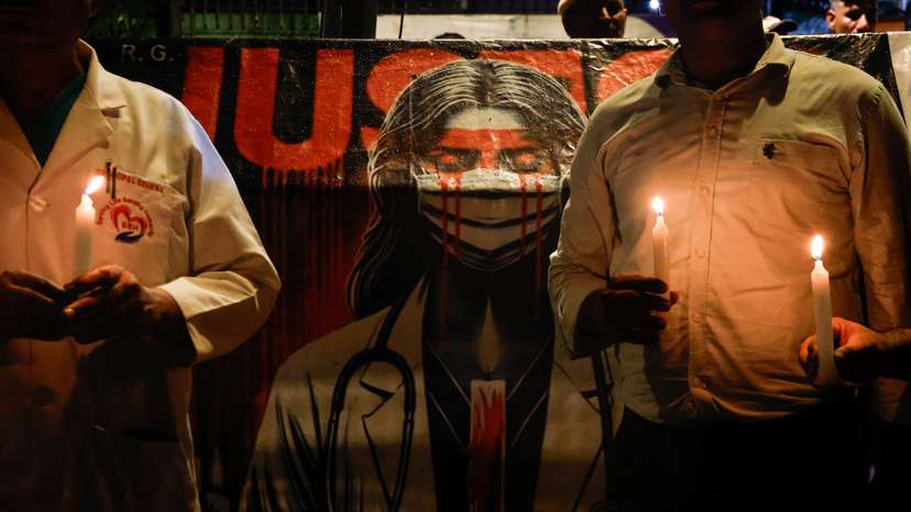 FILE PHOTO: Doctors hold candles during a protest rally in New Delhi