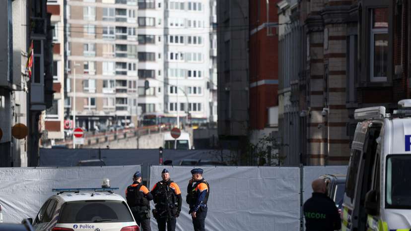 Police secure the site of a synagogue damaged by an explosion in Liege